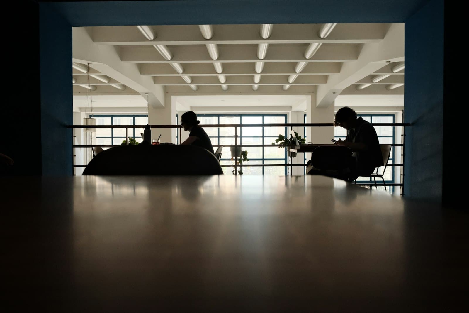 Two colleagues in honest conversation at a table